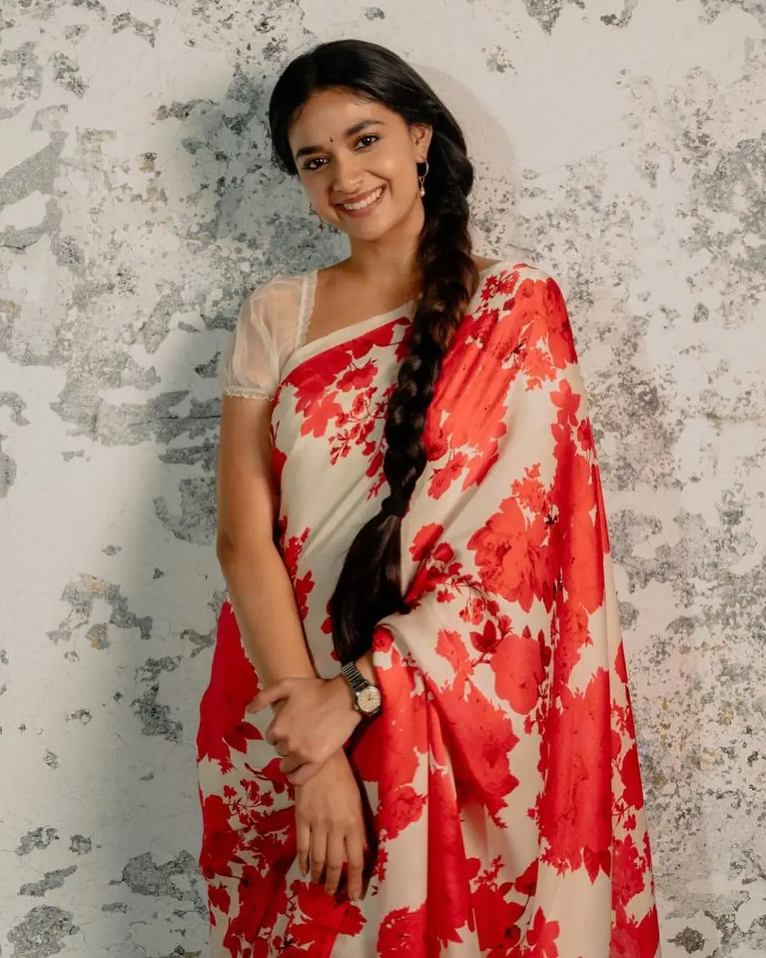 Keerthy Suresh Stills in Orange Saree Sleeveless White Blouse